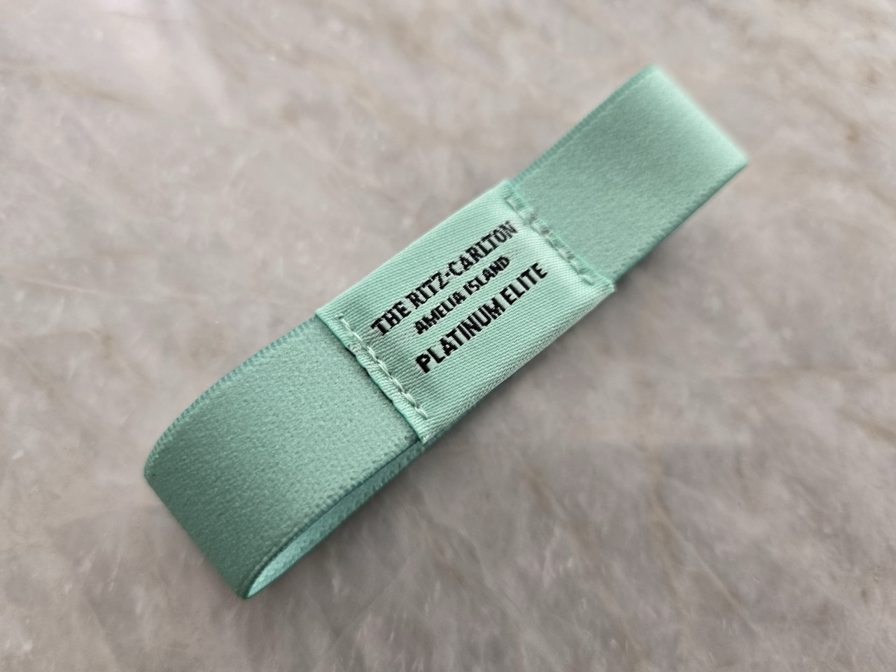 a green fabric label with black text