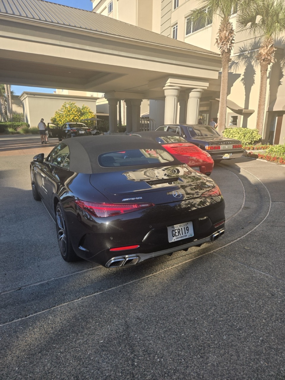 a black car parked in a parking lot